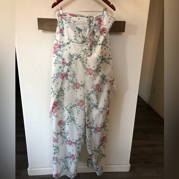 Eloquii|White chiffon floral halter jumpsuit with wide leg, open leg detail•••22 - Picture 6 of 17